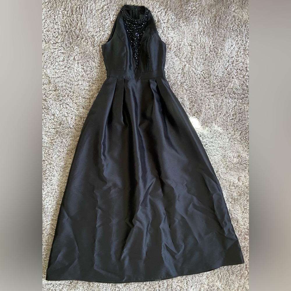 Black high neck dress with sheer beaded deep v-neck